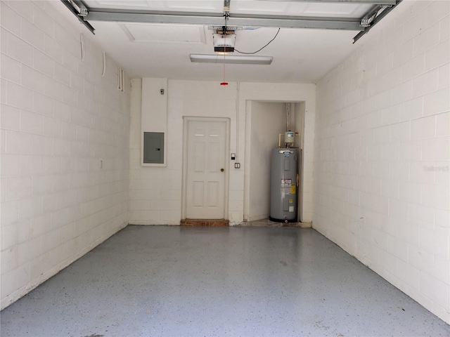 3658 Oakdale Cir Unit 100, Oviedo, FL 32765 - garage with electric water heater, electric panel, a garage door opener, and concrete block wall