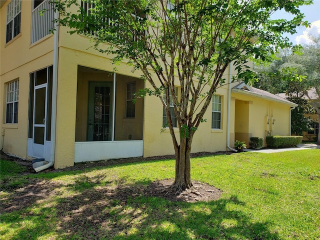 3658 Oakdale Cir Unit 100, Oviedo, FL 32765 - view of home's exterior featuring a yard and stucco siding