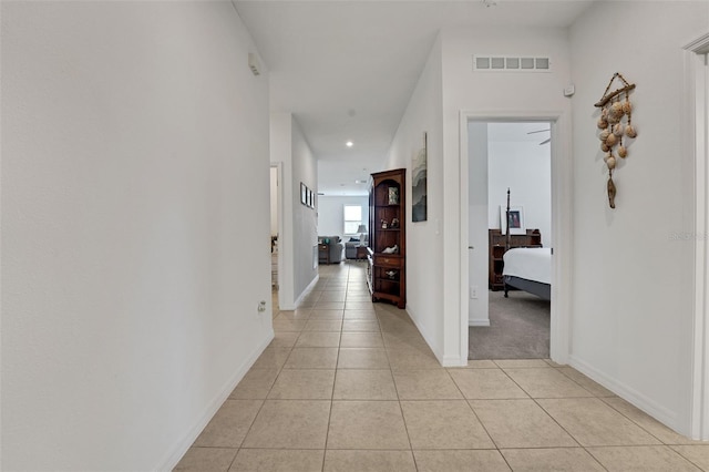387 Avi Ct, Titusville, FL 32796 - hallway with light tile patterned floors, recessed lighting, and baseboards