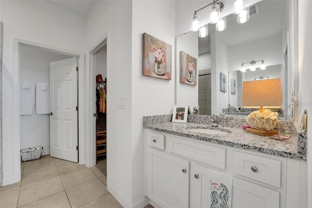 387 Avi Ct, Titusville, FL 32796 - full bathroom with vanity, tile patterned floors, and a spacious closet