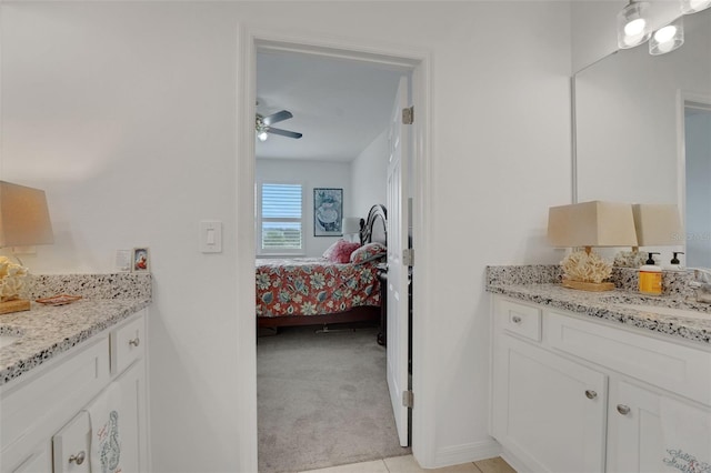 387 Avi Ct, Titusville, FL 32796 - bathroom with vanity, ensuite bathroom, ceiling fan, and baseboards