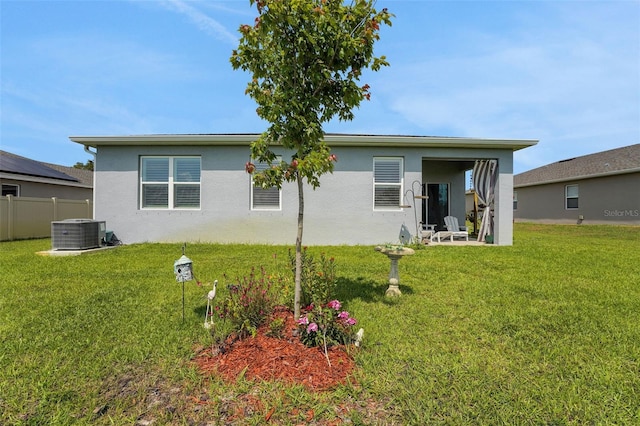 387 Avi Ct, Titusville, FL 32796 - rear view of house with central AC and stucco siding