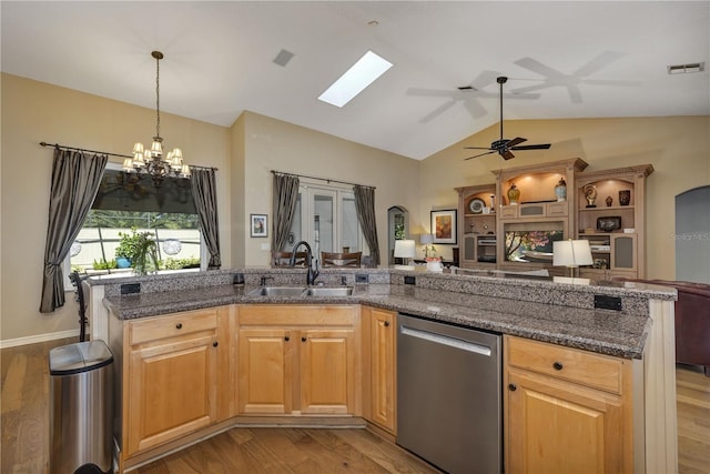 612 Golden Dawn, Apopka, FL 32712 - kitchen with stainless steel dishwasher, open floor plan, a sink, light wood-style flooring, and lofted ceiling