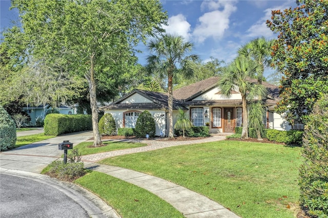 612 Golden Dawn, Apopka, FL 32712 - ranch-style home with driveway, a front lawn, and stucco siding