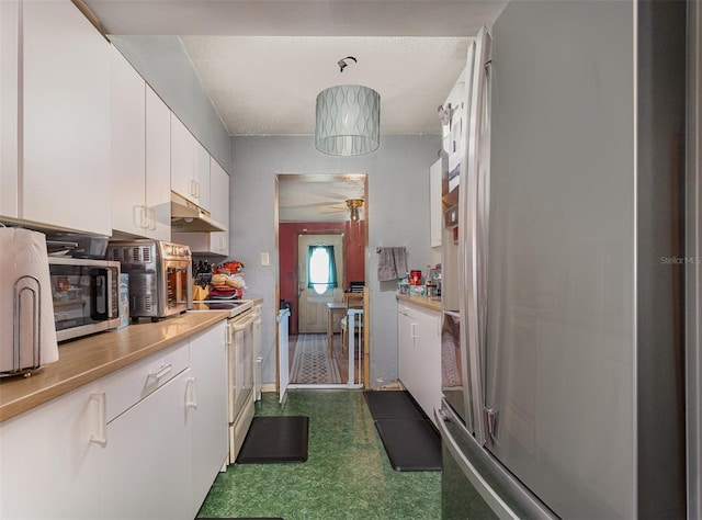 11509 Cameron St, Orlando, FL 32817 - kitchen featuring under cabinet range hood, stainless steel appliances, white cabinetry, dark flooring, and light countertops