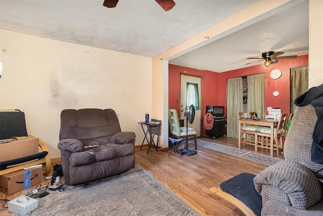 11509 Cameron St, Orlando, FL 32817 - living area with a ceiling fan, wood finished floors, and baseboards