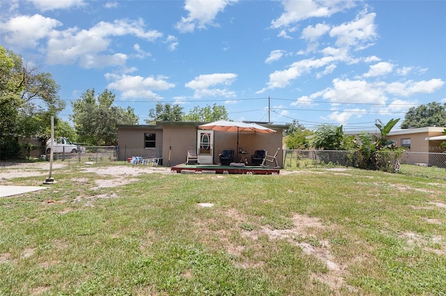 11509 Cameron St, Orlando, FL 32817 - back of property with stucco siding and a patio