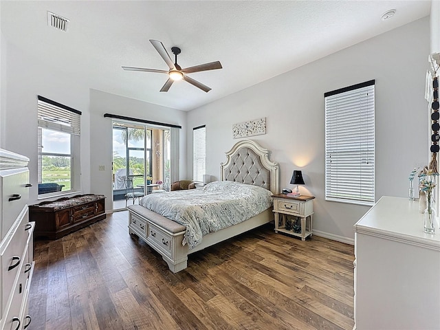 27143 Nostalgia Dr, Leesburg, FL 34748 - bedroom with access to outside, dark wood-style flooring, ceiling fan, and baseboards
