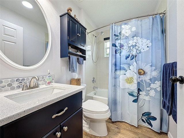 27143 Nostalgia Dr, Leesburg, FL 34748 - full bathroom with vanity, wood finished floors, toilet, and shower / bath combo