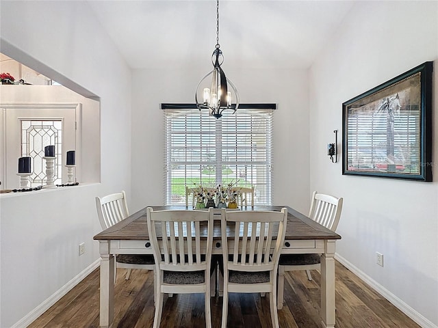 27143 Nostalgia Dr, Leesburg, FL 34748 - dining area with a chandelier, wood finished floors, and baseboards