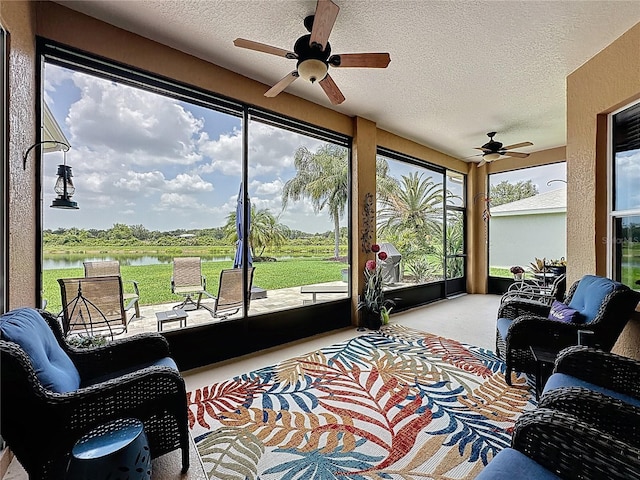 27143 Nostalgia Dr, Leesburg, FL 34748 - sunroom / solarium with a water view, a textured ceiling, and carpet flooring