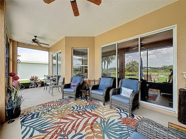 27143 Nostalgia Dr, Leesburg, FL 34748 - sunroom with a ceiling fan, carpet, a textured ceiling, and a textured wall