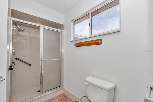 8443 SW 109th Pl, Ocala, FL 34481 - bathroom with a shower stall, toilet, tile patterned floors, and baseboards