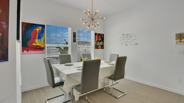 6013 Mount Zion Cir, Deland, FL 32724 - dining room featuring wood finished floors, a chandelier, and baseboards