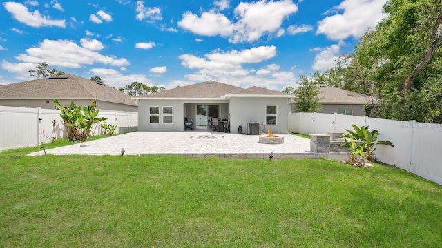 6013 Mount Zion Cir, Deland, FL 32724 - back of house with central air condition unit, an outdoor fire pit, a patio area, and stucco siding