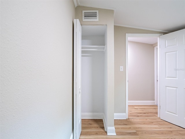 1229 Deneece Ter, Daytona Beach, FL 32117 - hallway featuring light wood finished floors, crown molding, and baseboards