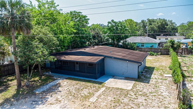1229 Deneece Ter, Daytona Beach, FL 32117 - rear view of house with a sunroom