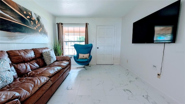 331 Greens End St, Orlando, FL 32810 - living area featuring baseboards and light marble finish floors