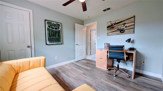 331 Greens End St, Orlando, FL 32810 - office space with wood finished floors, a ceiling fan, and baseboards