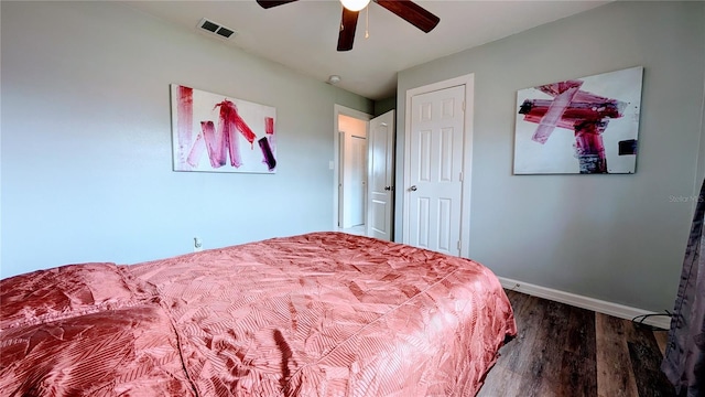 331 Greens End St, Orlando, FL 32810 - bedroom featuring dark wood finished floors, baseboards, and a ceiling fan