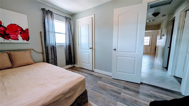 331 Greens End St, Orlando, FL 32810 - bedroom featuring light wood-type flooring and baseboards