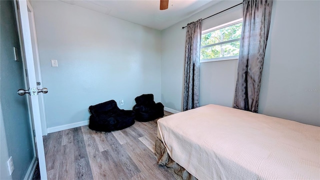 331 Greens End St, Orlando, FL 32810 - bedroom with wood finished floors, baseboards, and ceiling fan