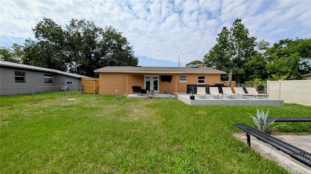 331 Greens End St, Orlando, FL 32810 - rear view of house featuring french doors, a patio, and stucco siding