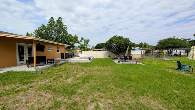 331 Greens End St, Orlando, FL 32810 - view of yard featuring french doors and a patio