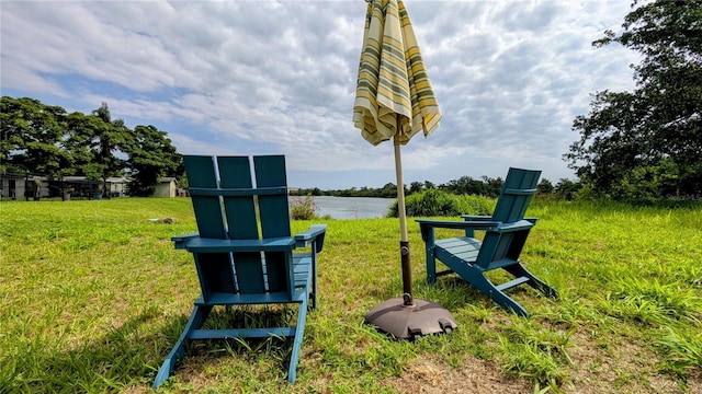 331 Greens End St, Orlando, FL 32810 - view of community featuring a lawn and a water view