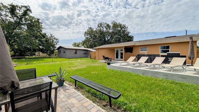 331 Greens End St, Orlando, FL 32810 - view of yard with french doors and a patio area
