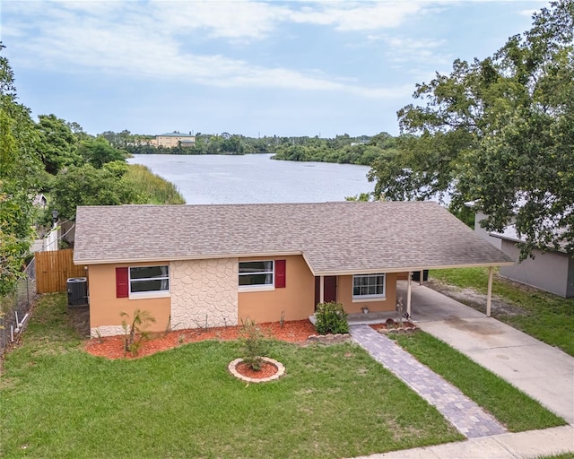 331 Greens End St, Orlando, FL 32810 - ranch-style house with concrete driveway, a carport, a water view, and roof with shingles
