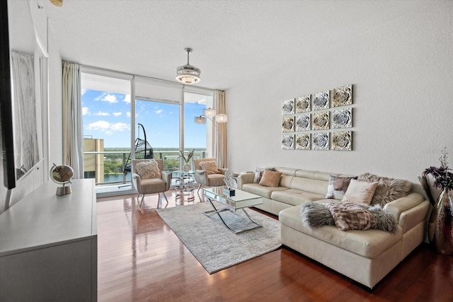150 E Robinson St Unit 16B-2 # 1605, Orlando, FL 32801 - living room with a wall of windows, wood finished floors, and a textured ceiling