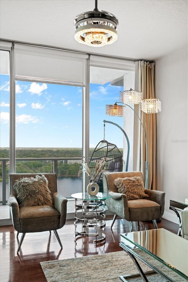 150 E Robinson St Unit 16B-2 # 1605, Orlando, FL 32801 - sitting room featuring floor to ceiling windows, wood finished floors, and a water view