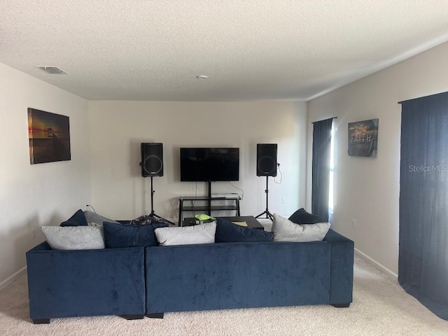 268 Fiddlewood Ct, Davenport, FL 33837 - living area featuring light carpet, a textured ceiling, and baseboards