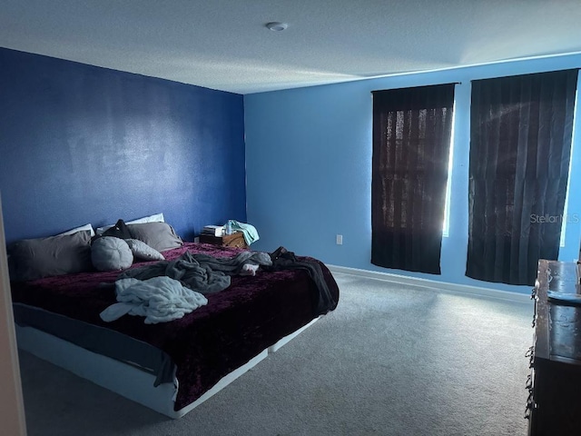 268 Fiddlewood Ct, Davenport, FL 33837 - bedroom with carpet flooring, baseboards, and a textured ceiling