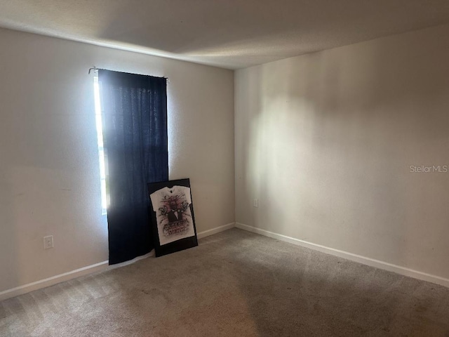 268 Fiddlewood Ct, Davenport, FL 33837 - carpeted spare room featuring baseboards