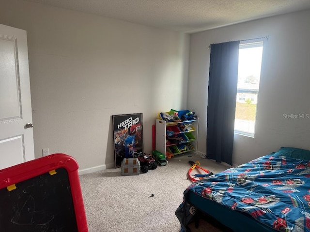 268 Fiddlewood Ct, Davenport, FL 33837 - bedroom with carpet flooring and baseboards