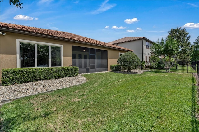 11741 Savona Way, Orlando, FL 32827 - back of property featuring stucco siding, a sunroom, and a tile roof