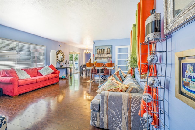 1919 E S St, Orlando, FL 32801 - living area featuring a chandelier, wood finished floors, and a textured ceiling