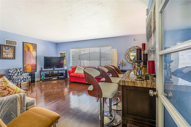 1919 E S St, Orlando, FL 32801 - living area with hardwood / wood-style flooring and a textured ceiling