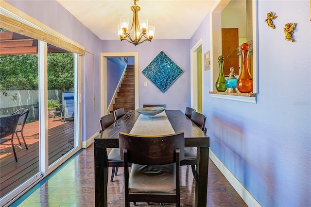 1919 E S St, Orlando, FL 32801 - dining room featuring wood finished floors, stairway, a chandelier, and baseboards