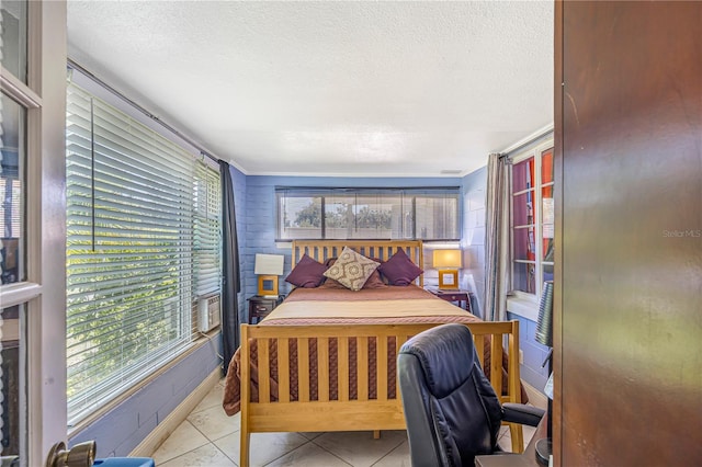 1919 E S St, Orlando, FL 32801 - bedroom featuring a textured ceiling and tile patterned floors
