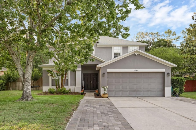 1245 Reagans Reserve Blvd, Apopka, FL 32712 - view of front of home with concrete driveway, a garage, and stucco siding