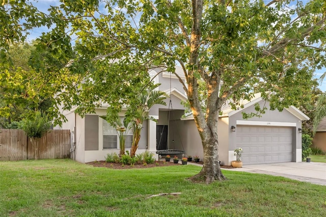 1245 Reagans Reserve Blvd, Apopka, FL 32712 - view of property hidden behind natural elements with driveway, an attached garage, and stucco siding