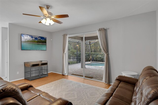 1245 Reagans Reserve Blvd, Apopka, FL 32712 - living area featuring ceiling fan, wood finished floors, and baseboards