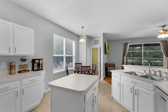 1245 Reagans Reserve Blvd, Apopka, FL 32712 - kitchen with a sink, dishwasher, healthy amount of natural light, and light tile patterned flooring