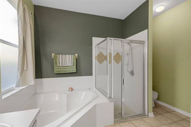 1245 Reagans Reserve Blvd, Apopka, FL 32712 - bathroom with toilet, a garden tub, tile patterned flooring, and a shower stall