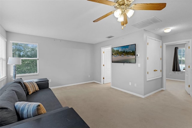 1245 Reagans Reserve Blvd, Apopka, FL 32712 - carpeted living area with baseboards and ceiling fan