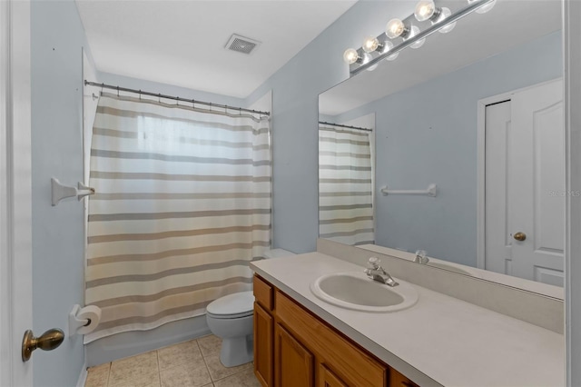 1245 Reagans Reserve Blvd, Apopka, FL 32712 - bathroom with vanity, toilet, and tile patterned flooring