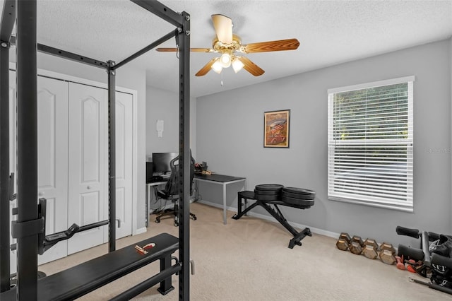 1245 Reagans Reserve Blvd, Apopka, FL 32712 - workout area featuring a ceiling fan, light carpet, a textured ceiling, and baseboards